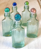 Glass Pebble Top Collecting Bottles